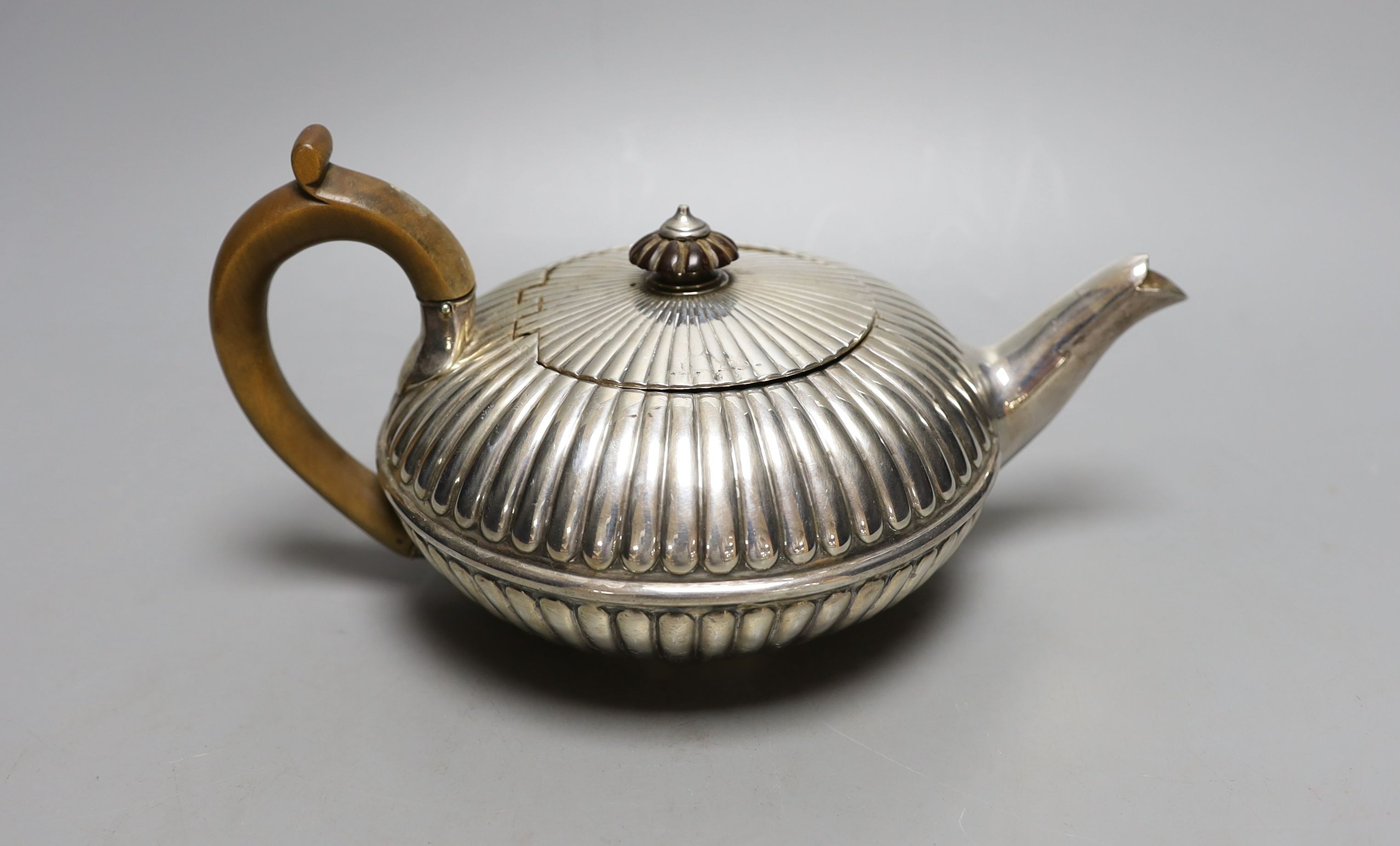 A George IV fluted silver teapot, Emes & Barnard, London, 1825, gross 13.5 oz.